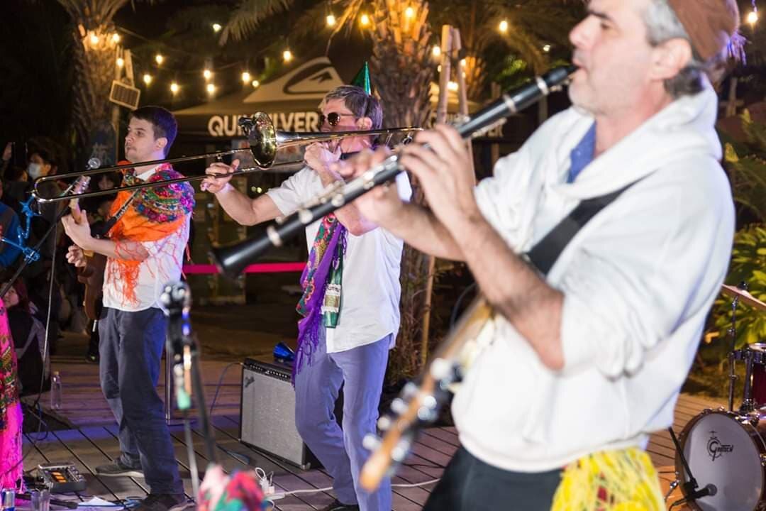 Balkazar's horn section performing at an outdoor event
