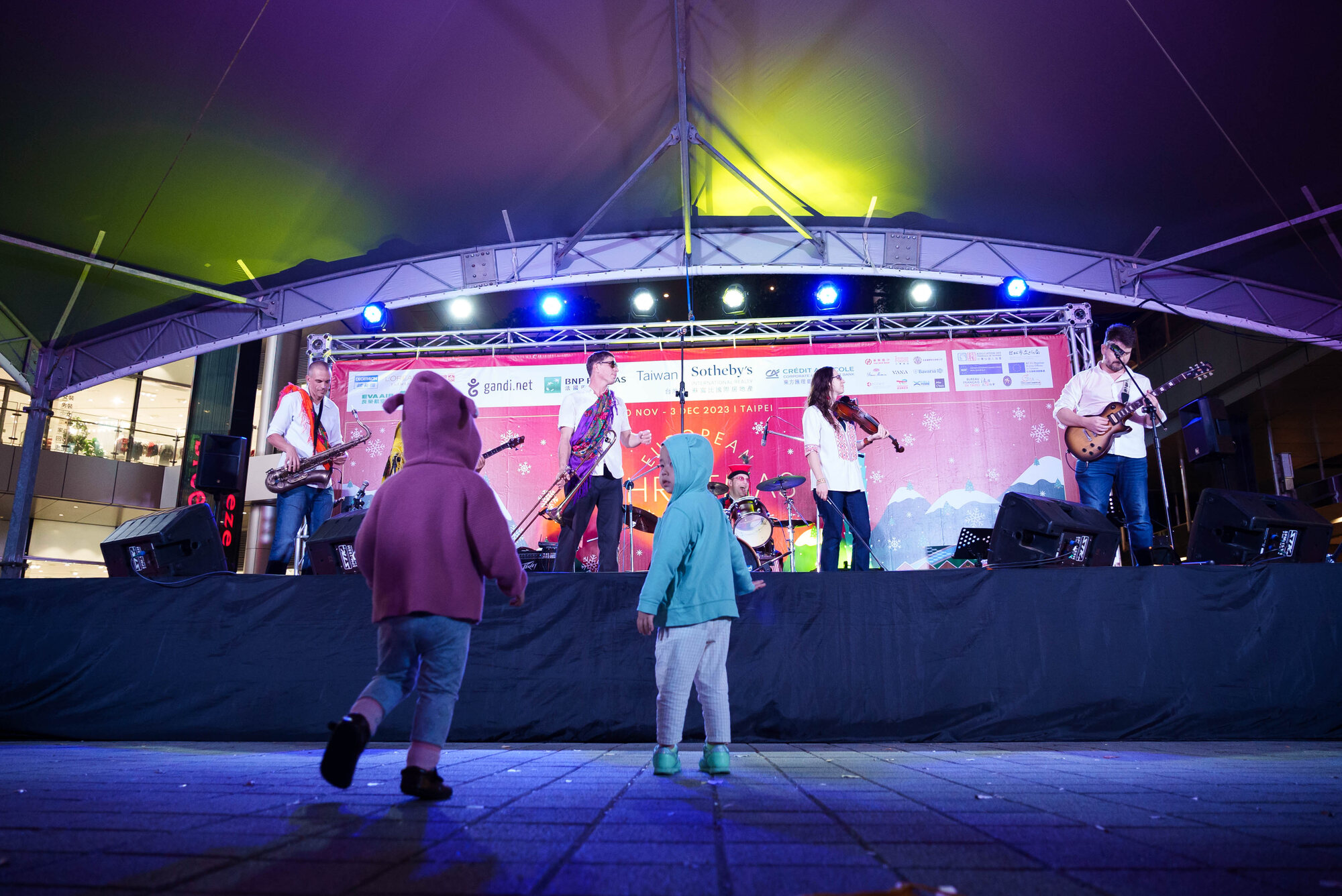 Balkazar performing as children dance at the European Christmas Market