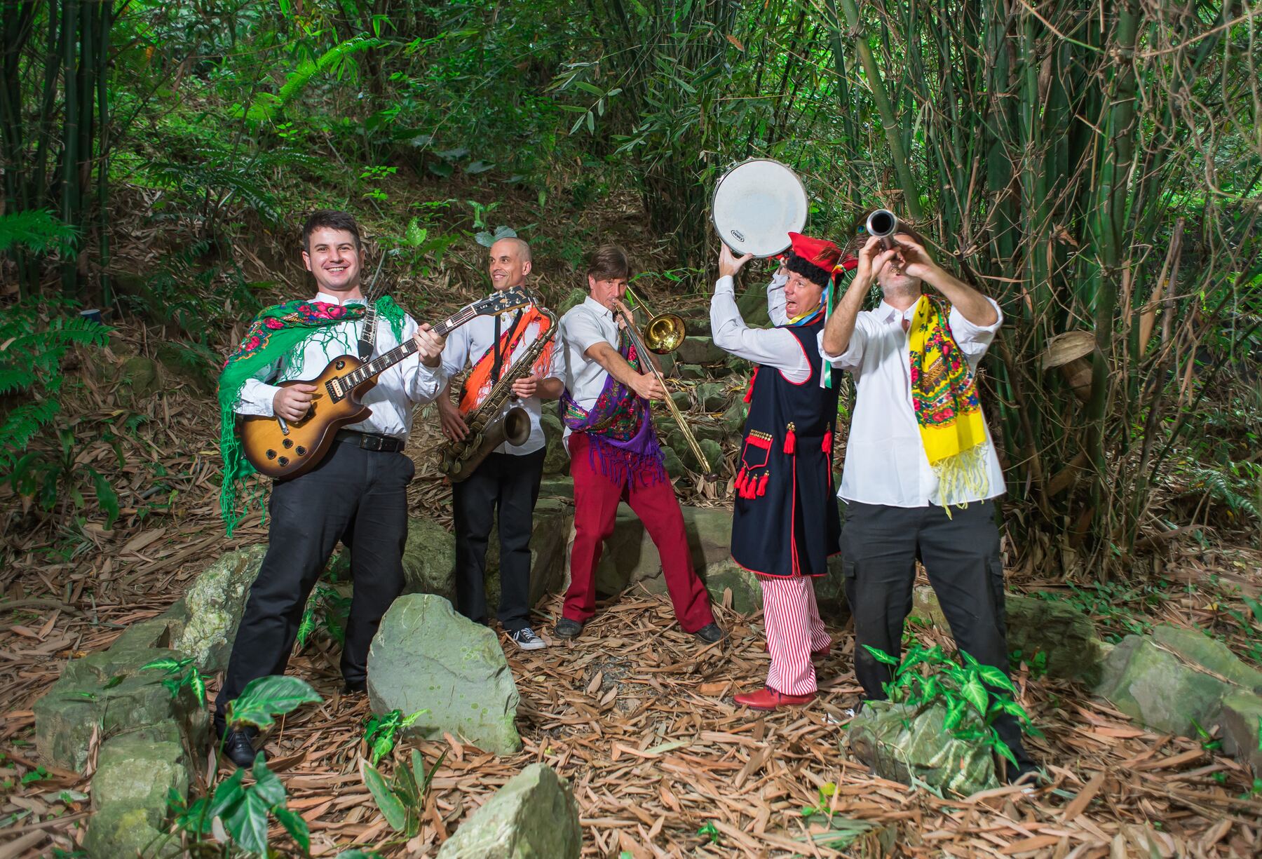 Balkazar posing with guitar, saxophone, trombone and drum at Veggie Fest